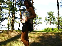 Cute young model goes into the woods to pose naked